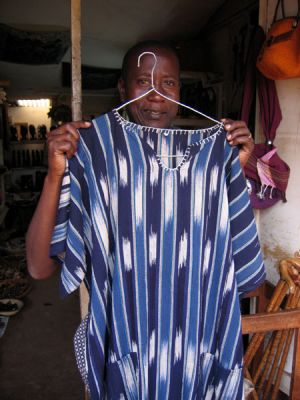 One of the vendors displaying a shirt
