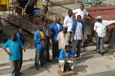 Men waiting at the Stone Town dock, Zanzibar