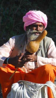 Snake charmer waiting for foreign tourists, Pokhara Lakeside