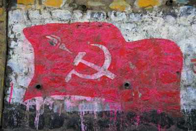 Nepal Communist banner painted on a wall along the Prithvi Highway