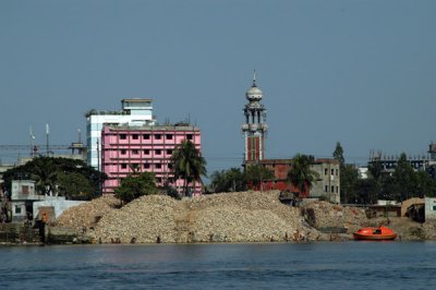 A pile of rubble in front of a pretty minaret, Dhaka-Shaympur (N23 40.859/E090 26.362)