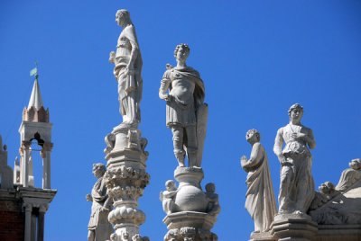 Statues on top of the Foscari Arch representing the Liberal Arts seen from the upper level of the east wing of the Doges Palace