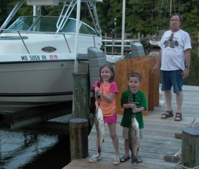 Ted's grandchildren, karlie &  logan 1st fishing trip 2006