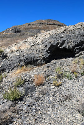 Rock detail and summit during the descent