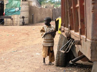 child playing with a big truck