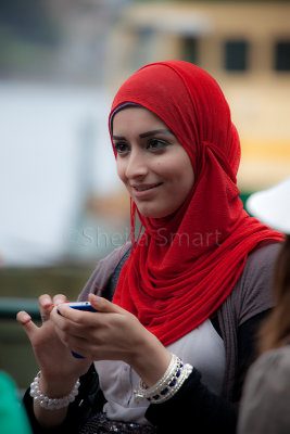 Young woman in hijab with mobile phone