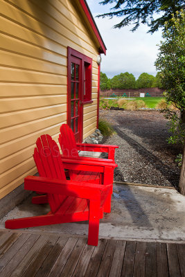 Red chairs on deck 