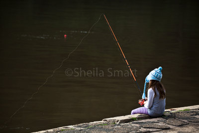 Girl fishing at Akuna Bay