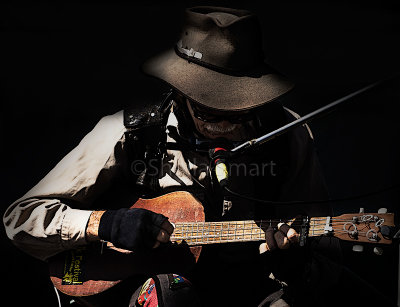 Country singer busker on guitar