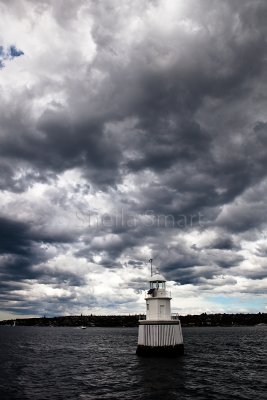 Sydney Harbour marker with clouds - portrait