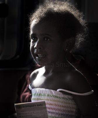 Little backlit girl on ferry 