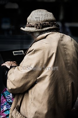 Elderly lady looking into bag 
