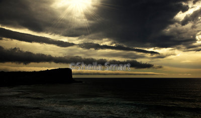 Avalon Headland with storm and sun with star filter