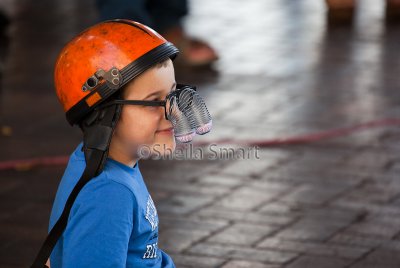 Little boy watching busker