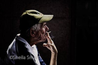 Smoking man in street