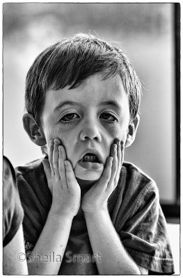 Little boy making face on ferry