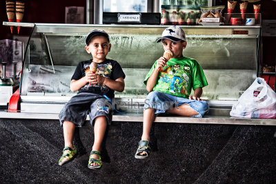 Two little boys eating icecream