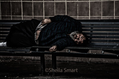 Sleeping man on bench 