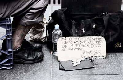 Sign of homeless man