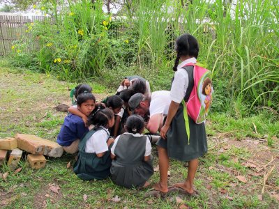 Children of Yukupari help Tom