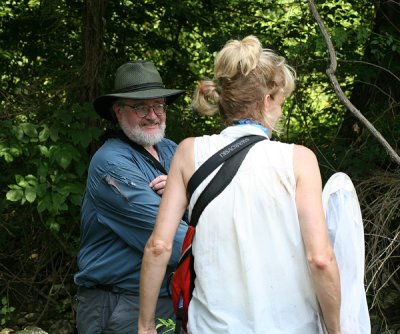 Earl showing Julie what the multiflora rose did to his shirt.