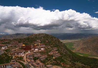 Ganden Monastery with clouds coming