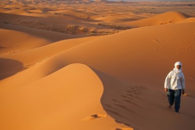 Man and Sand Merzouga Dunes.jpg