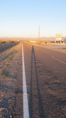 Me and my walking stick casting an early morning shadow towards California.JPG