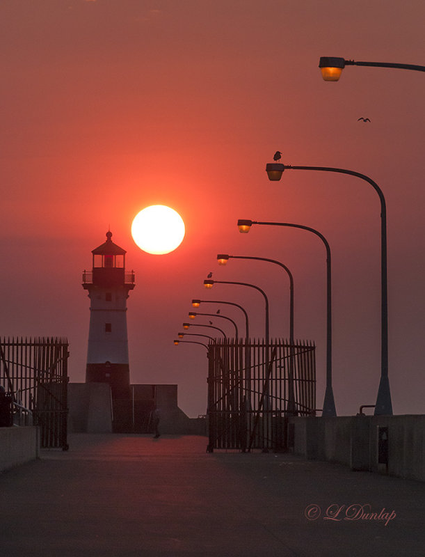 96.3 - Duluth:  North Breakwater Lighthouse With Sun