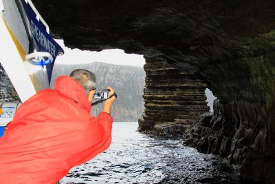 Warren with his movie camera, inside the cave.