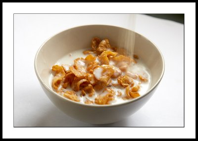 Pouring milk over cereals