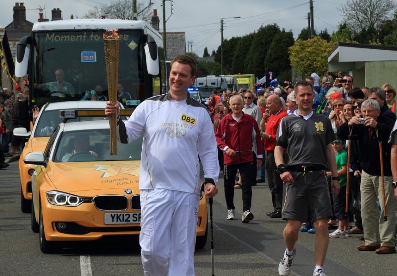 The Olympic flame passes through Trewoon, near St Austell
