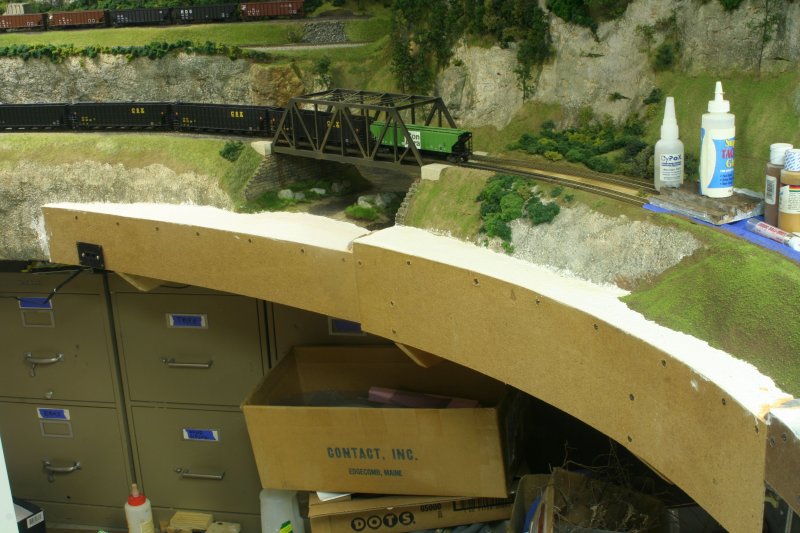 River bed in place all the way past the two track through truss bridge