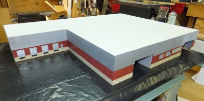 Overall view on table saw of warehouse with facade