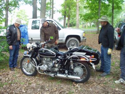 Airheads admiring the Ural, which is at its best sitting still.  They don't call it a Urinal for nothing...