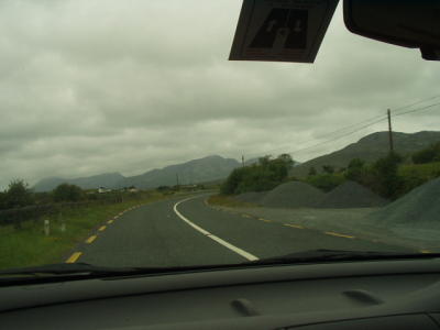 Connemara, with several of The Twelve Bens in the distance.  Note the little sticker on the windshield for us foreign drivers.
