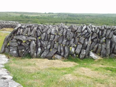 Unusual stone wall with the stones laid upright instead of flat.  Why doesn't it tip over?