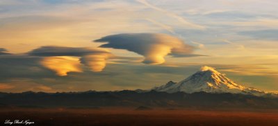 Rare triple standing lenticular formation over Mt Rainier