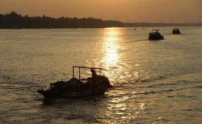 boats at sunset on Mekong River