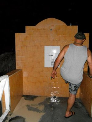 Elie washing off the sand after falling down the stairs =)