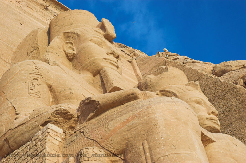 Statues of Ramesses II stand in front of The great temple