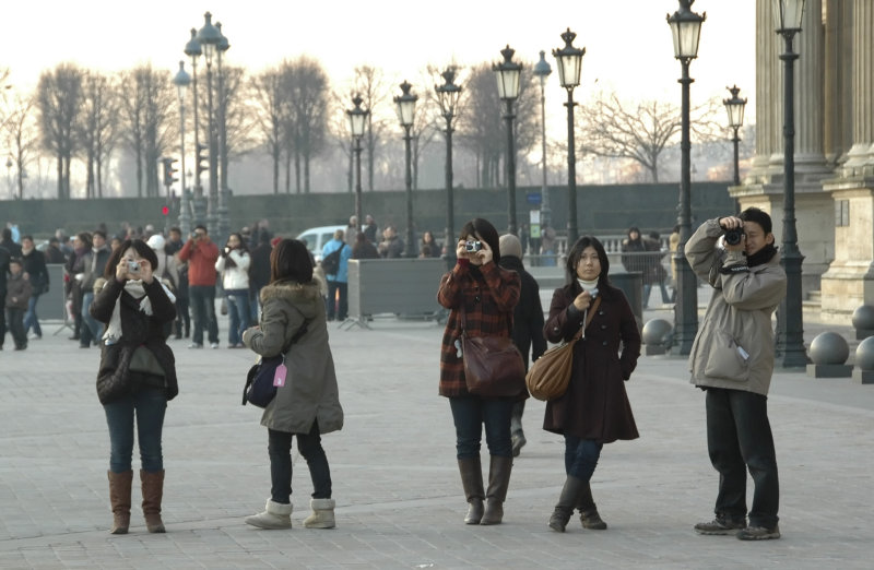 Taking pictures outside the Louvre