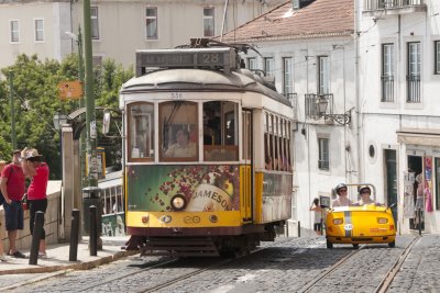 #28 Tram and one of those funny little cars they rent to tourists on Rua Norberto de Araújo