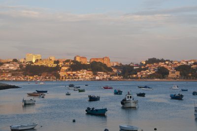 View of Porto at sunset across the harbor at Foz
