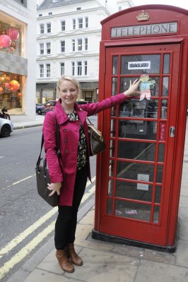 Flat Stanley in London  by a classic British telephone booth