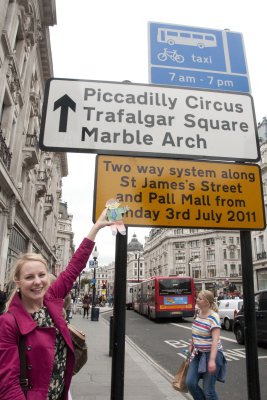 Susanna and Flat Stanley pointing to some of London's most famous places