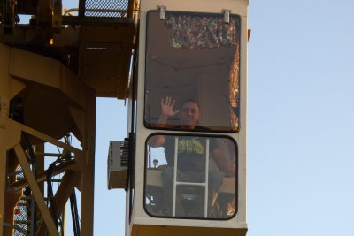The crane operator waves goodbye as we descend