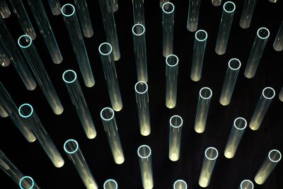 iso3200. Dark cabin exhibit with electric blue array of 1,368 glass tubes. #00403