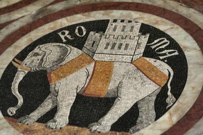 Mosaic-tile elephant within marble panel on floor