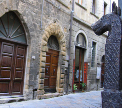 Volterra street from viewpoint of door horse